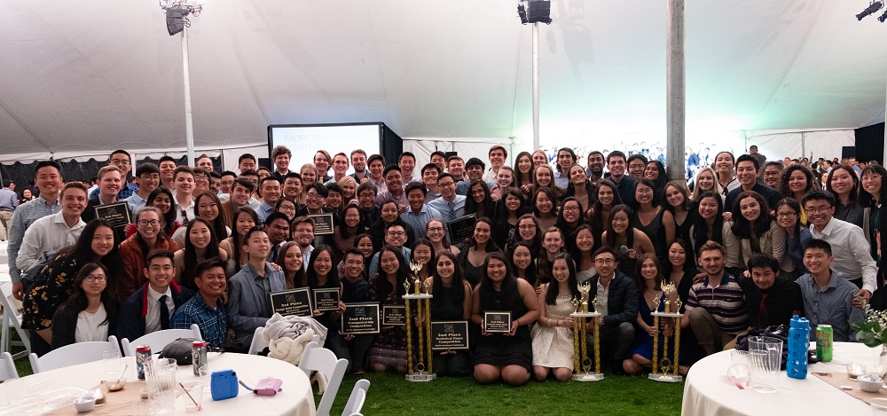 group photo of ASCE members in formal wear, members in front of group holding plaques and trophies