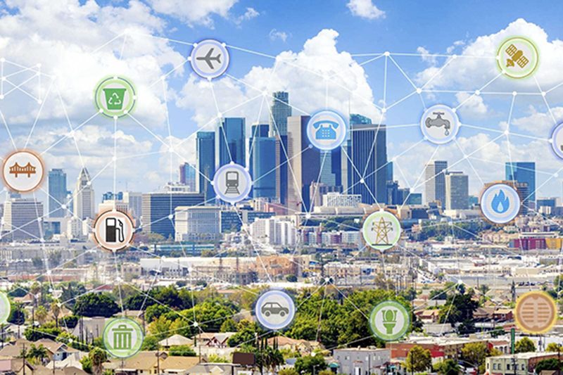 City skyline with symbols such as a recycling bin, plane, train, and phone connected with lines overlaid